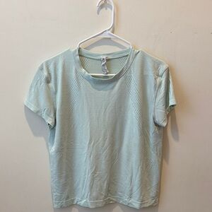 Lululemon Trained to Be short sleeve top. Worn multiple times- good condition.